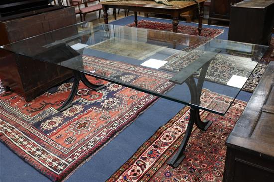 A glass top iron base dining table W.215cm